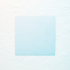 Wall Mural - silver glittering square copy space in the sunlight on the snow. bright christmas and winter holiday