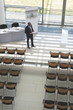 © wavebreak3 - Businessman practising speech in empty conference room