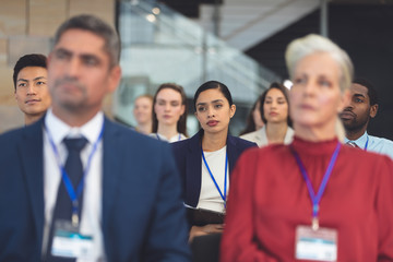 Wall Mural - Attentive young businesswoman in a business seminar