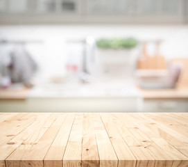Wall Mural - Wood table top on blur kitchen counter (room)background.For montage product display or design key visual