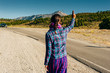 © IBRESTER - Cute American woman hitchhiking