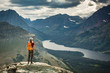 © Tandem Stock - Woman standing on summit near Two Medicine lake