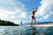 © Tandem Stock - People stand up Paddleboarding, Whitefish Lake, Whitefish, Glacier Country, Montana, USA.