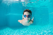 © Adnan - Happy young boy swim and dive underwater,fun in pool. Active healthy lifestyle, water sport activity and lessons with parents on summer family vacation with child.