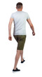 © ghoststone - Back view of going handsome man in shorts.