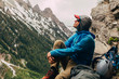 © Tandem Stock - A man relaxes at the base of 'Guides Wall' on a stormy day, Cascade Canyon, Grand Teton National Park, Wyoming, USA