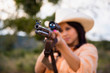 © Westend61 - USA, Texas, Young woman with hunting rifle