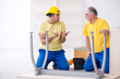 © Elnur - Two contractors carpenters working indoors