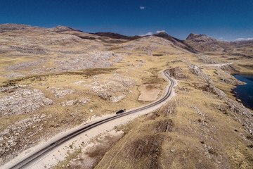 Wall Mural - Aerial drone view of a roadway in the Peruvian Highlands.