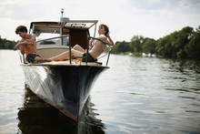 Young Couple On Motor Boat