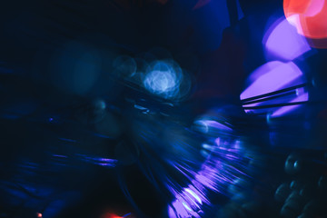 Poster - Beautiful abstract fiber optical network cable on a multi colored glow background.