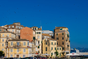 Wall Mural - CORFU / GREECE - JUNE 24, 2019: Traditional houses on the streets of Kerkyra, Corfu island