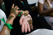 Closeup Of Moroccan Women Hands With Henna Decoration.