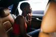 © Christin Nzobadila-Bela/PICHA - Woman having a conversation in a car