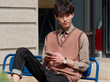 © atiger - Portrait of a handsome Chinese young man with Korean style clothes sitting and looking away with mobile phone in hand, male fashion, cool Asian young man lifestyle.