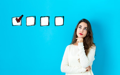 Checklist with young woman in a thoughtful face