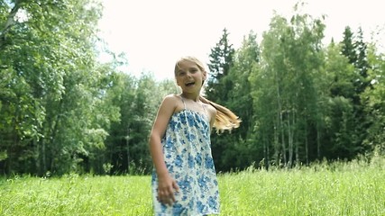 a pretty girl turns her head and shouts while smiling. childhood. kids, nature, summer casual fashio