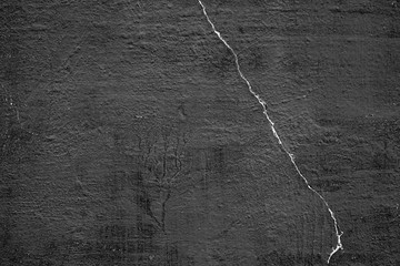 Texture of a concrete wall with cracks and scratches which can be used as a background