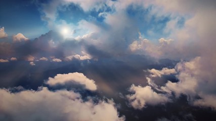 Wall Mural - Flying through heavenly beautiful sunny cloudscape. Amazing timelapse of golden fluffy clouds moving softly on the sky and the sun shining through the clouds with beautiful rays and lens flare. 