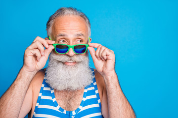 Close-up portrait of his he nice attractive funky cheerful cheery content gray-haired man spending leisure cool carefree life lifestyle isolated over bright vivid shine turquoise blue background