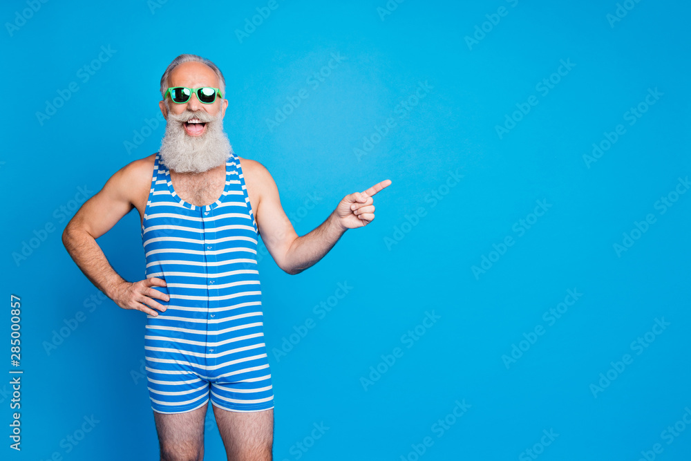 Portrait of his he nice attractive content funky excited positive cheerful cheery gray-haired man showing advice ad advert solution isolated over bright vivid shine turquoise blue background - obrazy, fototapety, plakaty 