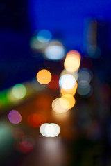 colorful lightblubs bokeh of city night road after sunset