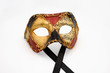 Golden, red and black venetian carnival mask isolated on white background (front view)