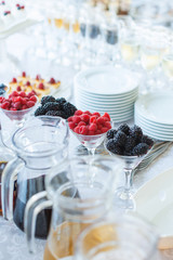 Fresh summer raspberry fruits on table