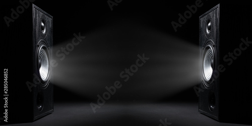 Fotografía Two sound speakers with free space between them on black background