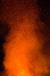 © liptakrobi - Fire sparks particles with flames isolated on black background.