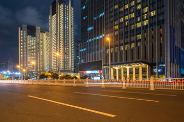 Wall Mural - Office buildings and highways at night in the financial center, qingdao, China