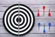 © 5second - Dartboard with darts on wooden table