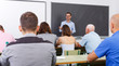 © JackF - Young lecturer talking to mixed age  students