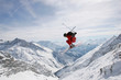 © Westend61 - Germany, Damkar, person jumping ski, side view