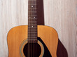 © Денис Полушин - Classical acoustic guitar brown on light wooden background