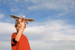 © Westend61 - Boy holding model aircraft