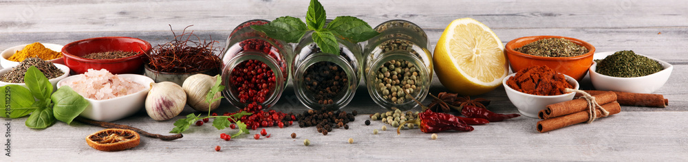 Spices and herbs on table. Food and cuisine ingredients with basil - obrazy, fototapety, plakaty 