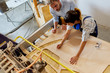 © ALTO IMAGES/Stocksy - Teacher Guiding Student In Using Laser Cutter