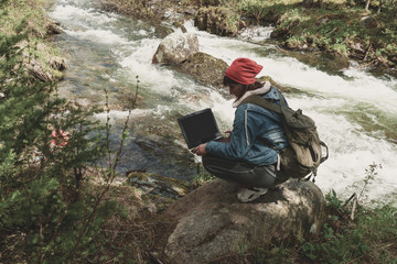 Wall Mural - woman using laptop outdoors