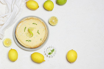 key lime pie on white background with limes