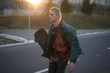 © Branko Starcevic/Stocksy - Young man skateboarding in the street.