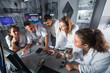 © JackF - Group of friends are solving quests to get out of escape room
