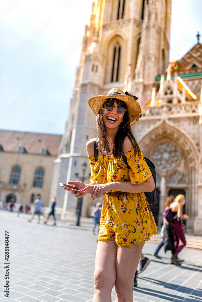 A young woman enjoying her trip to Budapest - obrazy, fototapety, plakaty 
