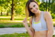 © fotofabrika - Close-up portrait of young beautiful sport woman in summer park