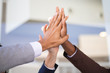© Mangostar - Business colleagues celebrating success and joining hands. Multiethnic group of man and women giving high five to each other. Achievement concept