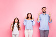 © deagreez - Portrait of cheerful family with wavy long haircut look up wear white t-shirt trousers checkered plaid shirt off-shoulders isolated over pink background