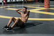© puhhha - Sport man doing abs crunches exercise, fitness workout at street