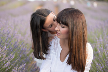 Family in lavender flowers field