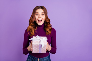 Poster - Portrait of cheerful lady holding hand package for anniversary screaming shouting isolated over purple background