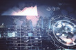 © peshkova - Financial graph on night city scape with tall buildings background multi exposure. Analysis concept.
